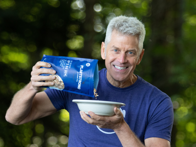 Man pouring Plantstrong product into a bowl